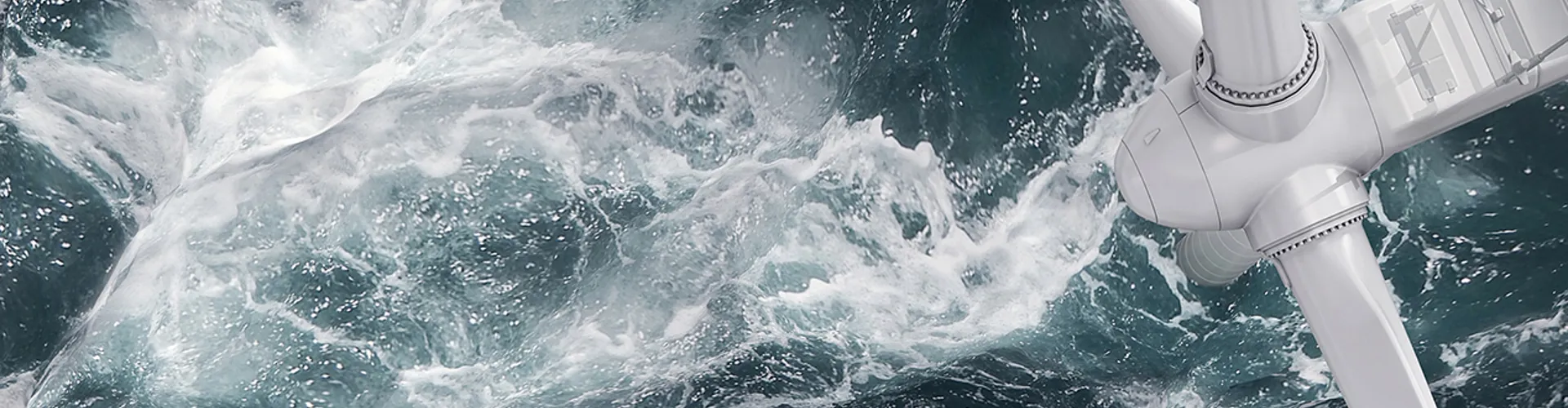 Aerial panorama of a close up wind turbine in the sea
