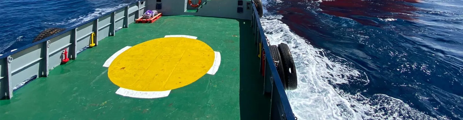 Offshore vessel alongside a wind turbine installation ship.