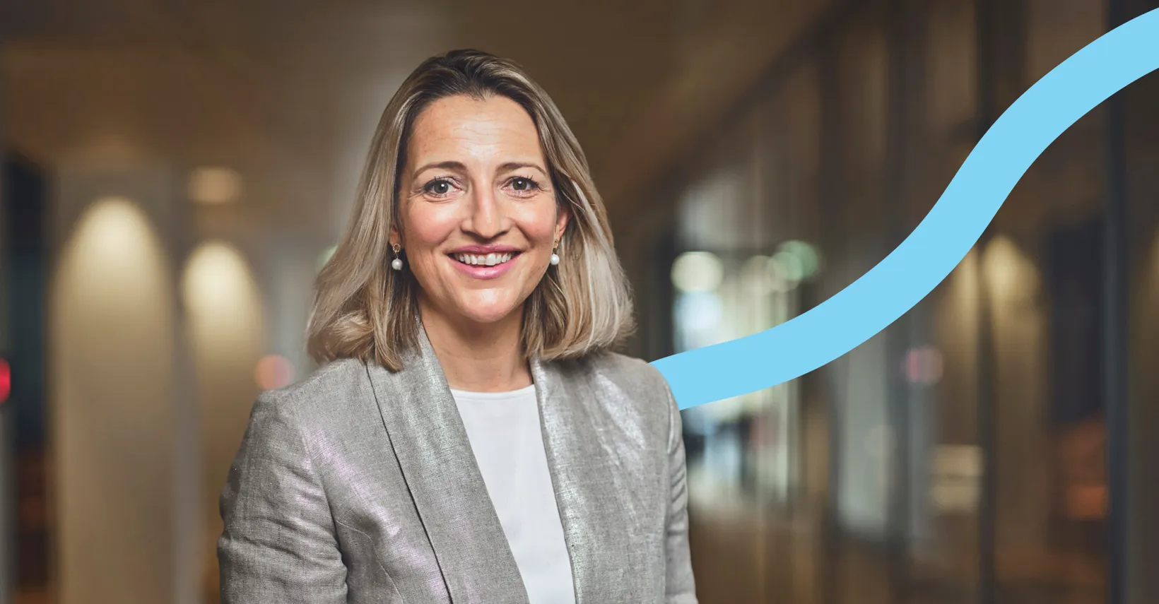 woman smiling, blue graphic background