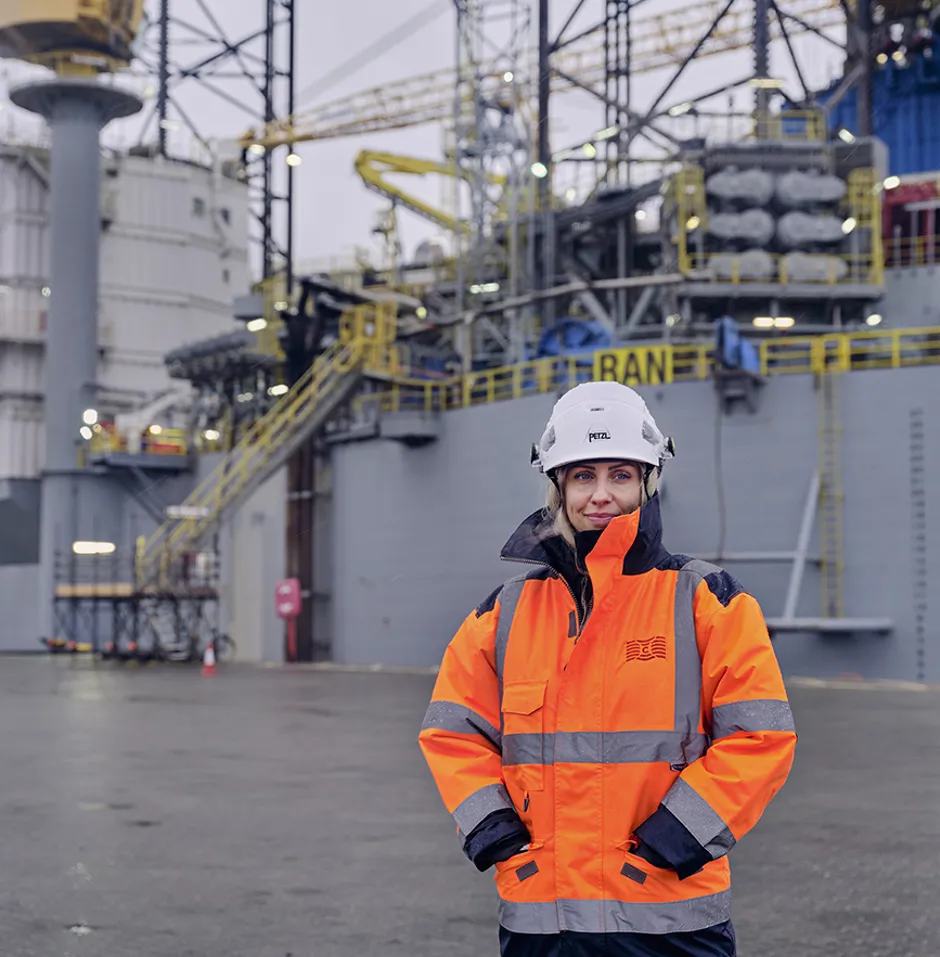 quayside employees smiling in high vis jacket