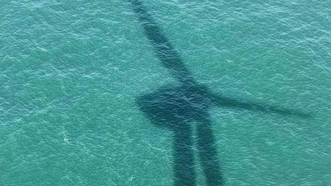 wind turbine reflection in water