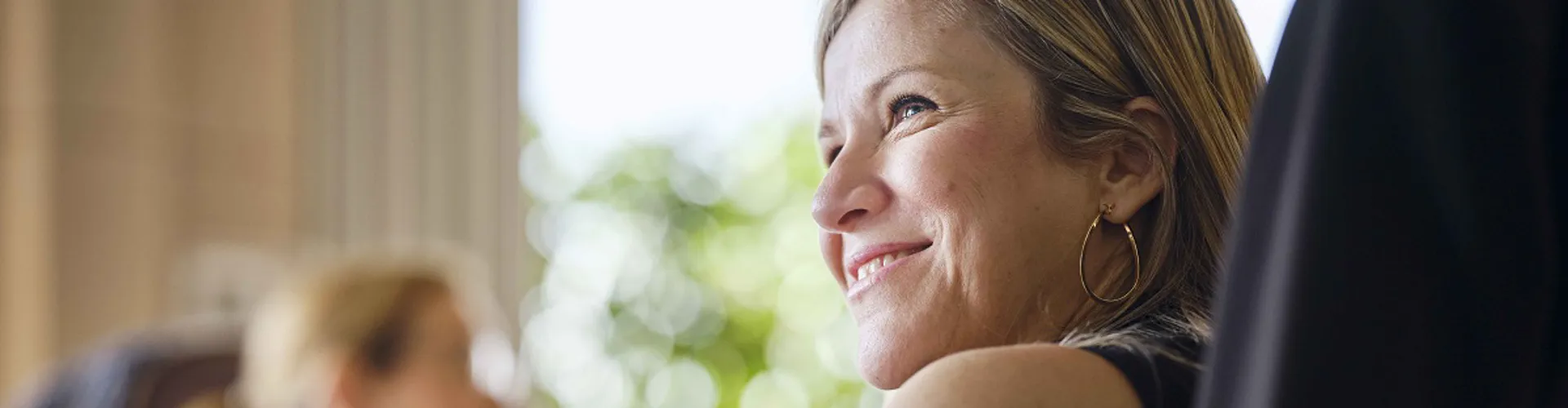 Team member from the Compliance team smiling