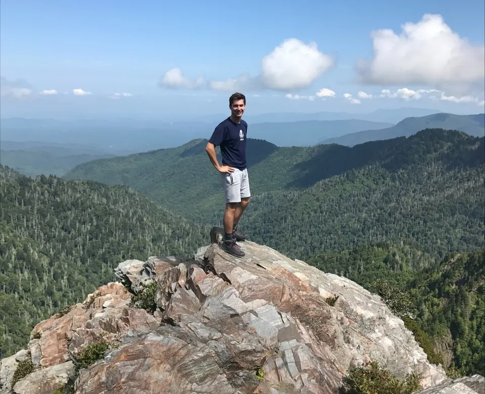 Sam climbing rocky mountains