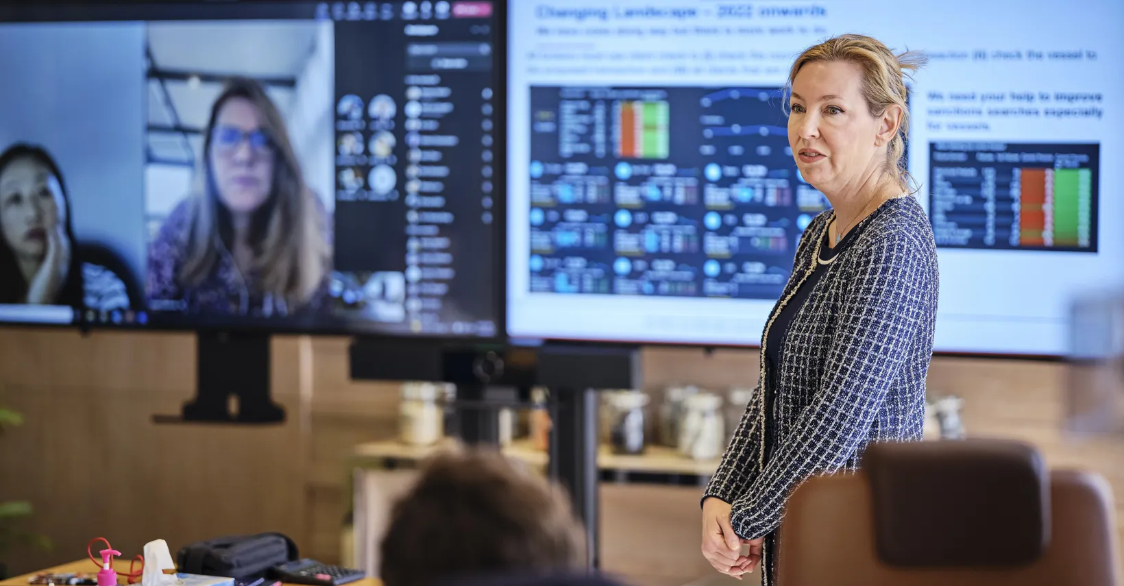 woman standing giving presentation