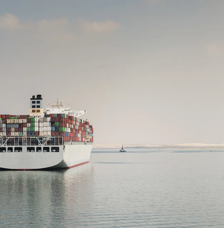 Large container ship on calm water.