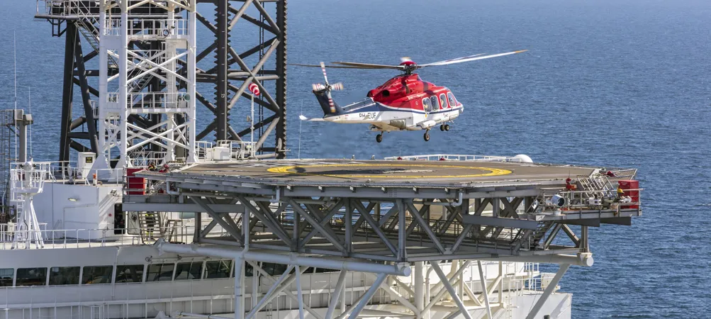 Helicopter landing on an offshore platform.