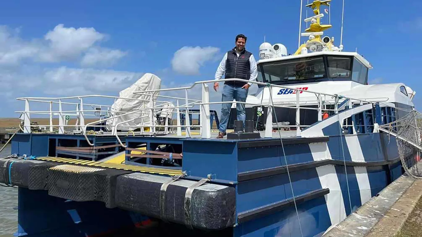 man standing on deck of boat