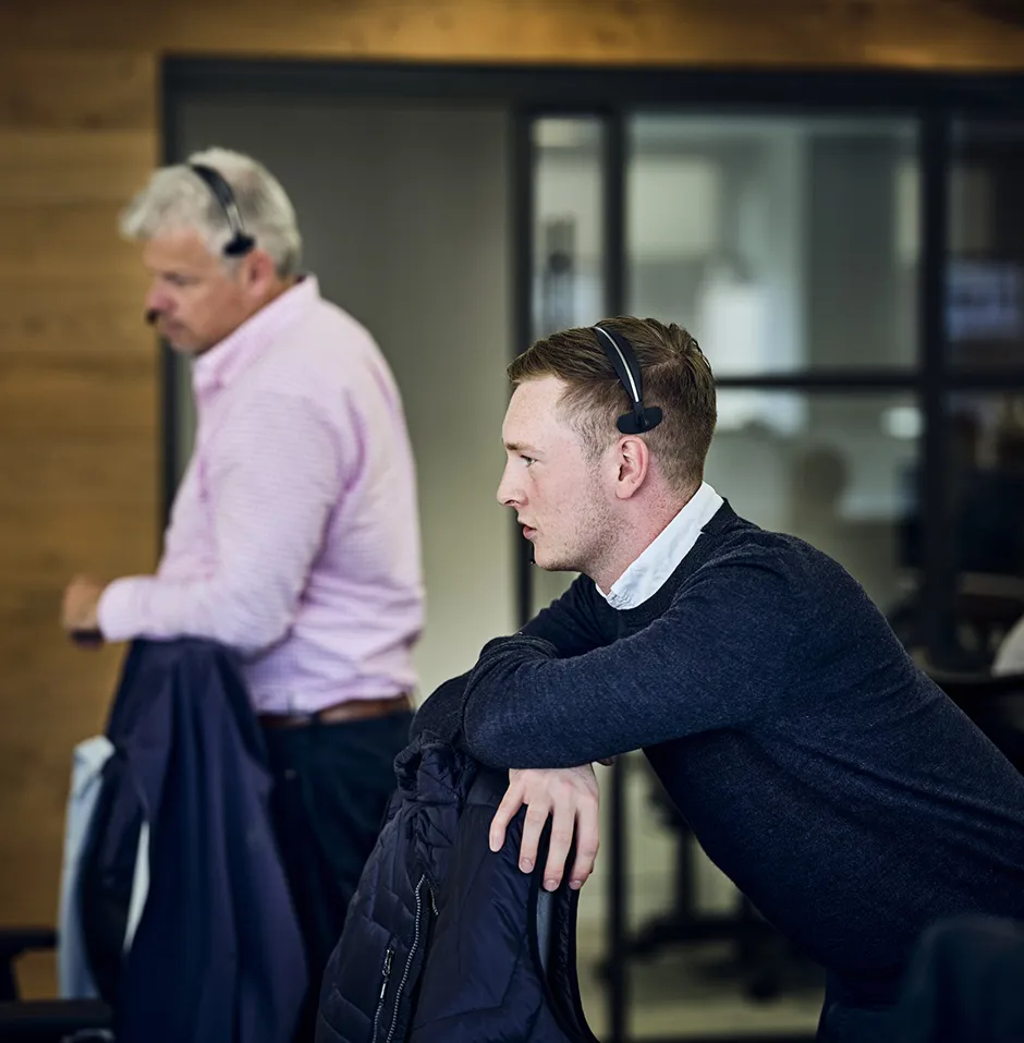 brokers on the phone making deals with clients